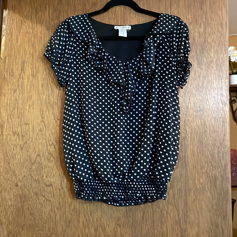 Sweet and sophisticated, black with white polka front ruffle blouse. Size: MP